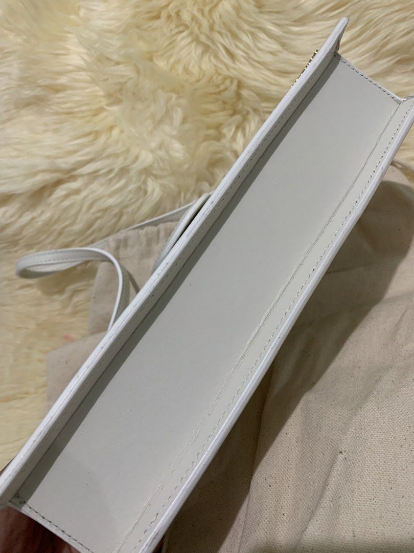 Jacquemus Le Chiquito Long Bag White (Category: Luxury Bags & Wallets) located in Manila. Submitted by mylildarlingamari (Listing ID 1461898250, Image 2). Description: - Authentic White Jacquemus Bag - Genuine Leather Material - Elegant Gold Hardware - Comes with Original Dust Bag and Tags - Minor scuff mark on the front (clearly shown in photos) - Ideal for evening events and going out.