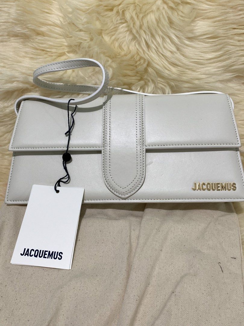 Jacquemus Le Chiquito Long Bag White (Category: Luxury Bags & Wallets) located in Manila. Submitted by mylildarlingamari (Listing ID 1461898250, Image 3). Description: - Authentic White Jacquemus Bag - Genuine Leather Material - Elegant Gold Hardware - Comes with Original Dust Bag and Tags - Minor scuff mark on the front (clearly shown in photos) - Ideal for evening events and going out.