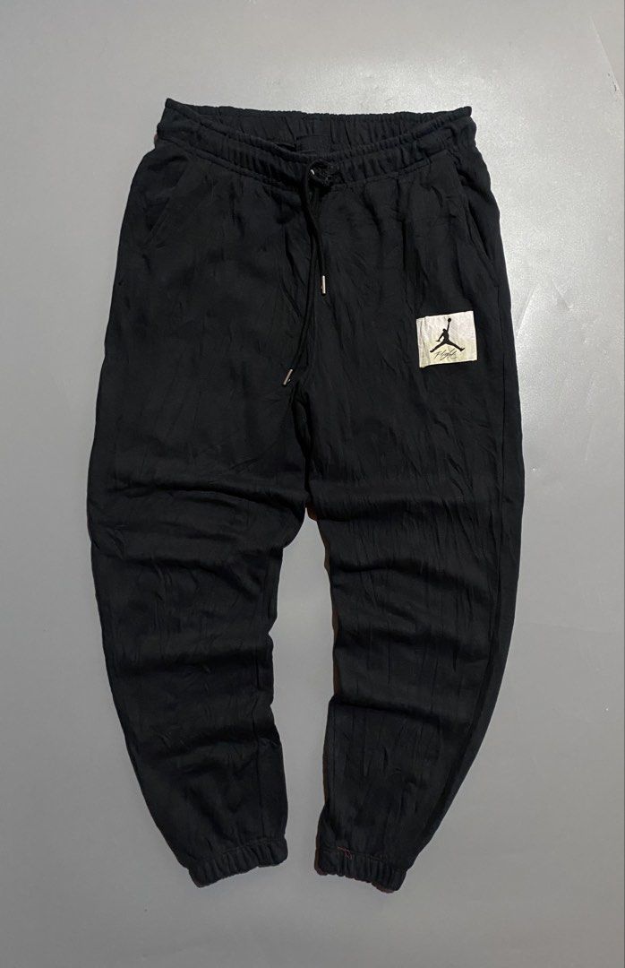 Jordan Flight Jogger Pants Black (Category: Joggers) located in Manila. Submitted by delunakenn94368 (Listing ID 1461949826, Image 1). Description: - Black Jordan sweatpants - Features iconic Jumpman logo patch on left leg - Comfortable elastic waistband with adjustable drawstring - Ribbed cuffs for a snug fit - Made in Indonesia - Ideal for everyday casual wear or athletic training.