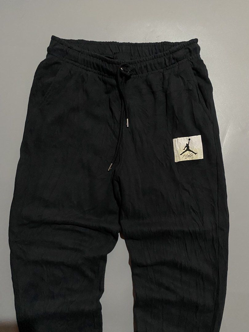 Jordan Flight Jogger Pants Black (Category: Joggers) located in Manila. Submitted by delunakenn94368 (Listing ID 1461949826, Image 2). Description: - Black Jordan sweatpants - Features iconic Jumpman logo patch on left leg - Comfortable elastic waistband with adjustable drawstring - Ribbed cuffs for a snug fit - Made in Indonesia - Ideal for everyday casual wear or athletic training.