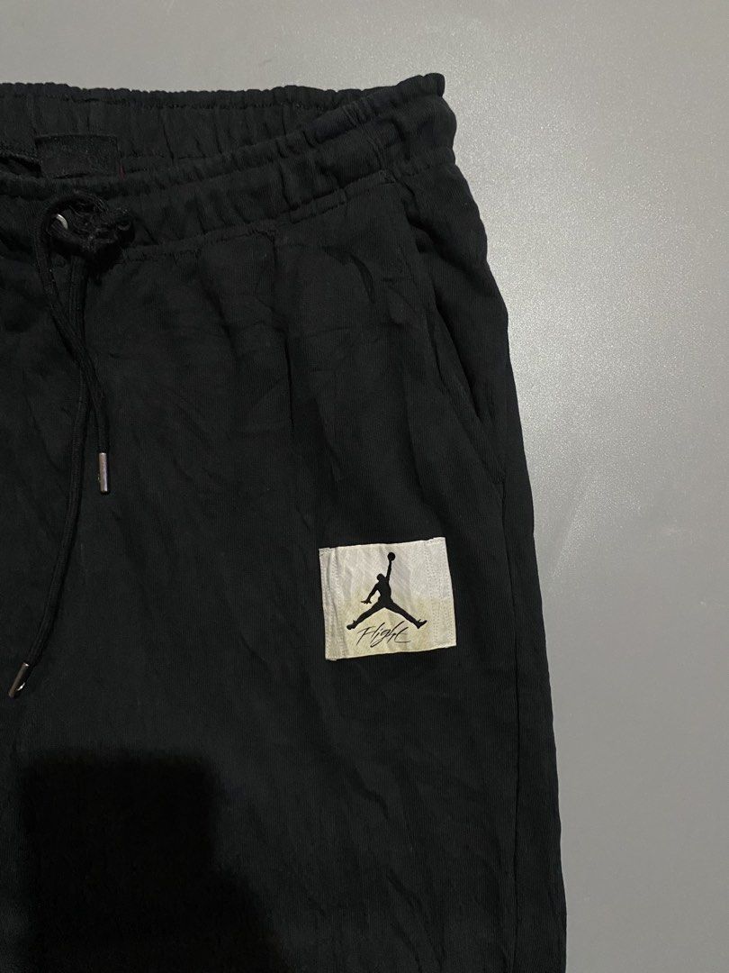 Jordan Flight Jogger Pants Black (Category: Joggers) located in Manila. Submitted by delunakenn94368 (Listing ID 1461949826, Image 3). Description: - Black Jordan sweatpants - Features iconic Jumpman logo patch on left leg - Comfortable elastic waistband with adjustable drawstring - Ribbed cuffs for a snug fit - Made in Indonesia - Ideal for everyday casual wear or athletic training.