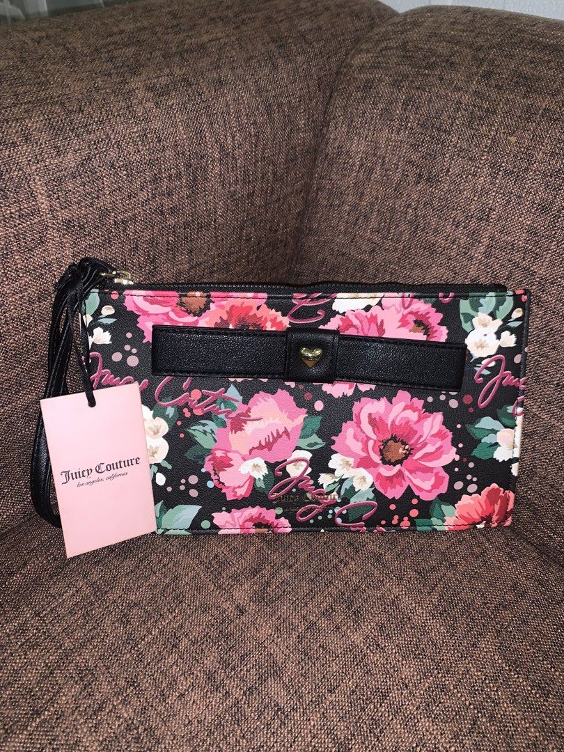 Juicy Couture Wallet Purse (Category: Purses & Pouches) located in Manila. Submitted by jei_sol (Listing ID 1461910725, Image 1). Description: ORIGINAL JUICY COUTURE FROM U.S.A. - Cute Juicy Couture wristlet - Black background with vibrant floral print - Black bow detail with gold heart accent - Interior features multiple card slots and a zip pocket - Comes with original tags - Perfect for carrying your essentials.