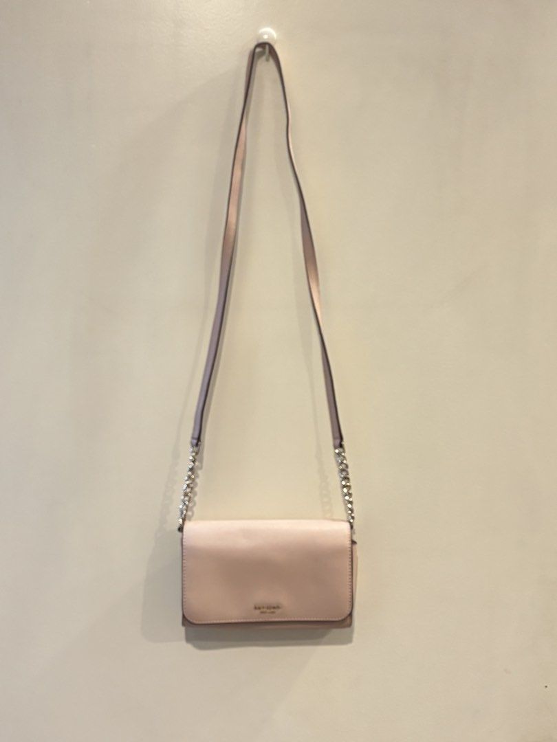 Kate Spade Cameron Small Flap Crossbody Bag (Category: Cross-body Bags) located in Pasig City. Submitted by shopgirl101 (Listing ID 1461821865, Image 1). Description: Kate Spade crossbody bag Color: Light Pink - Shoulder/ Crossbody Bag - Saffiano Calf Leather - KSNY Signature Lettering Logo on Front - Back Exterior Slip Pocket - Adjustable Leather Strap with Gold-Toned Chain Link Accents - Magnetic Snap Flap Closure - 1 Interior Zip Pocket; 1 Int
