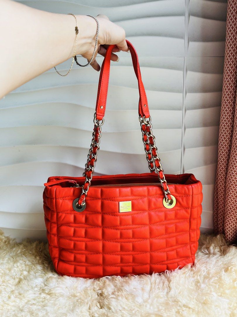 Kate Spade Quilted Leather Chain Shoulder Bag (Category: Luxury Bags & Wallets) located in Davao. Submitted by goodthingsph_ (Listing ID 1462034795, Image 1). Description: - Bright orange quilted leather handbag - Brand: Kate Spade - Silver chain detailing on straps - Fun, patterned interior lining - Spacious main compartment - Perfect for everyday or special occasions.