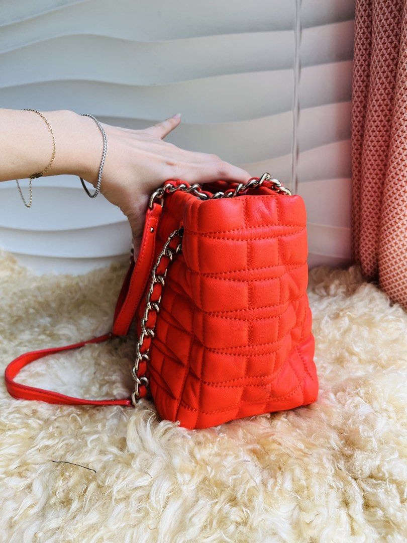 Kate Spade Quilted Leather Chain Shoulder Bag (Category: Luxury Bags & Wallets) located in Davao. Submitted by goodthingsph_ (Listing ID 1462034795, Image 2). Description: - Bright orange quilted leather handbag - Brand: Kate Spade - Silver chain detailing on straps - Fun, patterned interior lining - Spacious main compartment - Perfect for everyday or special occasions.