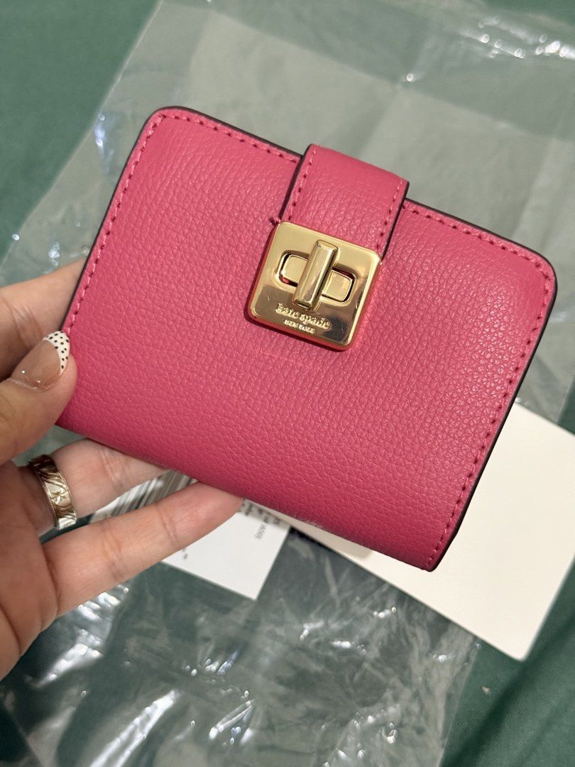 Kate Spade Small wallet Phoebe (Category: Wallets & Card holders) located in San Mateo. Submitted by patdrme (Listing ID 1461908173, Image 1). Description: FOR SALE: Kate Spade Small wallet "Phoebe" Rose oil Good condition. What you see is what you get. Original and Authentic money back guarantee. Can fit 5-6 cards + Folded bills and coins (konti lang) RFS: Declutter. .