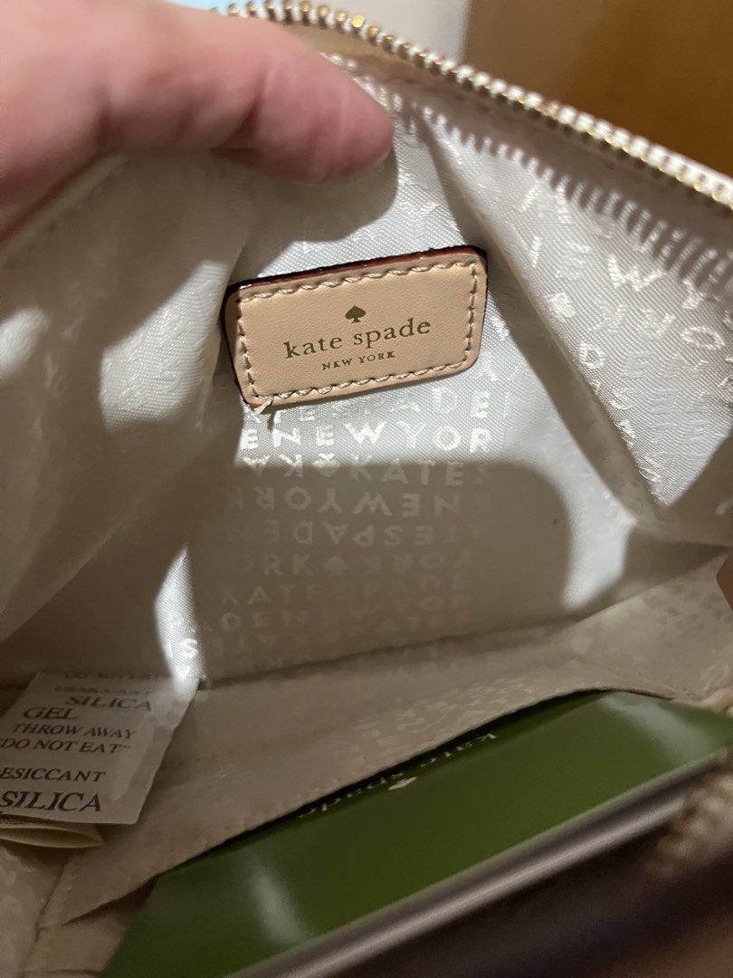 Authentic Kate Spade Wrislet (Category: Purses & Pouches) located in Quezon City. Submitted by kikays0215 (Listing ID 1461849983, Image 3). Description: - Authentic Kate Spade New York pouch - Charming pink leaf print design - Secure zip closure - Interior lined with Kate Spade logo pattern - Comes with care card - Ideal for organizing makeup, cards, or small essentials.