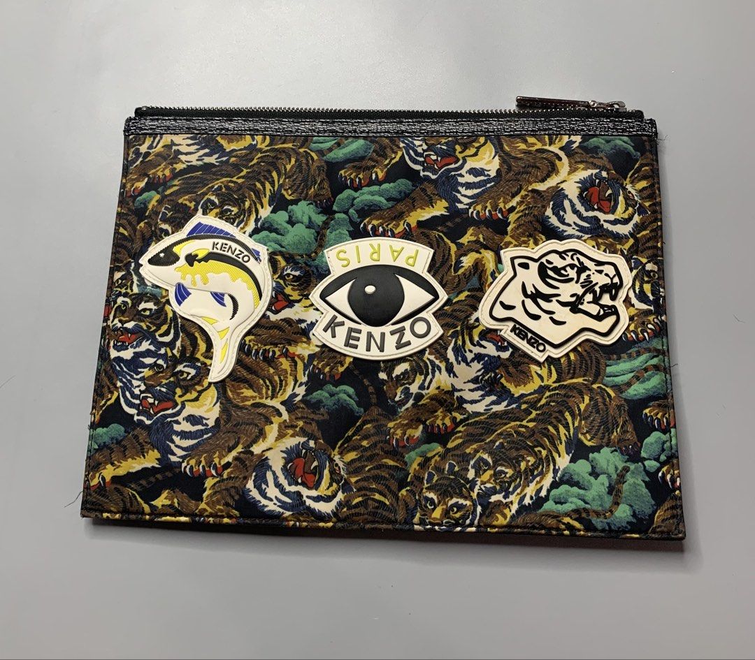 Kenzo Paris Pouch (Category: Belt bags, Clutches and Pouches) located in Binan City. Submitted by disqualified_but_undefeated (Listing ID 1461802583, Image 1). Description: WTS!!! 🔥🔥🔥🔥 Kenzo Multi-Icon Tiger Pouch Unisex Height- 8.5 inches Width- 11.5 inches In Good Condition 📩📩📩 DM to purchase Please Check Detailed Photos Posted For Your Reference Thankyou!!! Kenzo Multi-Icon Flying Tiger Pouch, featuring some of the French fashion house’