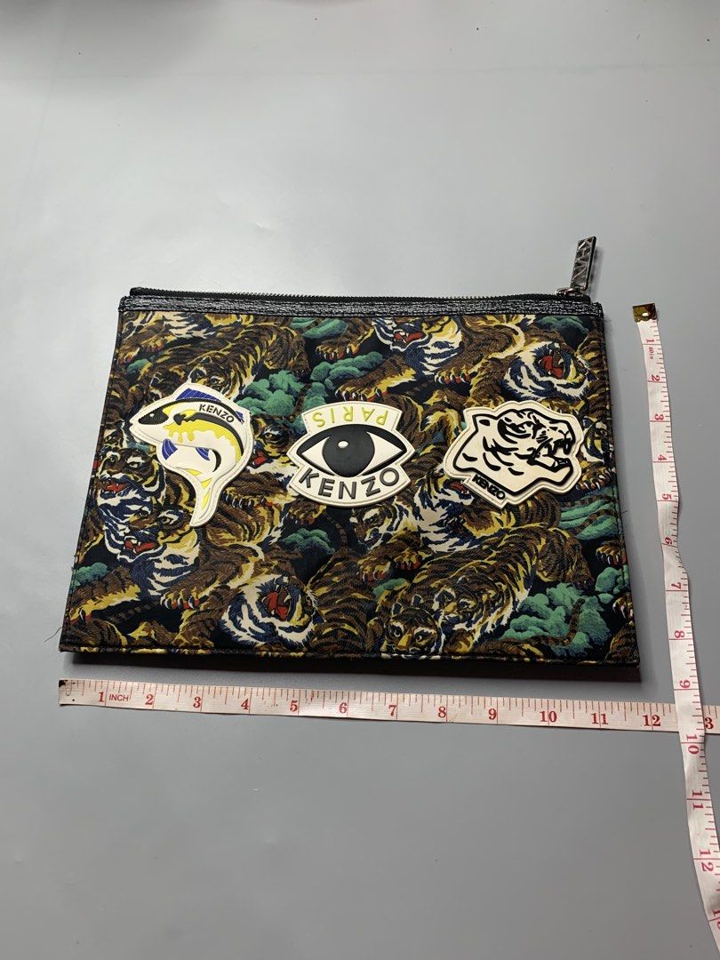 Kenzo Paris Pouch (Category: Belt bags, Clutches and Pouches) located in Binan City. Submitted by disqualified_but_undefeated (Listing ID 1461802583, Image 3). Description: WTS!!! 🔥🔥🔥🔥 Kenzo Multi-Icon Tiger Pouch Unisex Height- 8.5 inches Width- 11.5 inches In Good Condition 📩📩📩 DM to purchase Please Check Detailed Photos Posted For Your Reference Thankyou!!! Kenzo Multi-Icon Flying Tiger Pouch, featuring some of the French fashion house’
