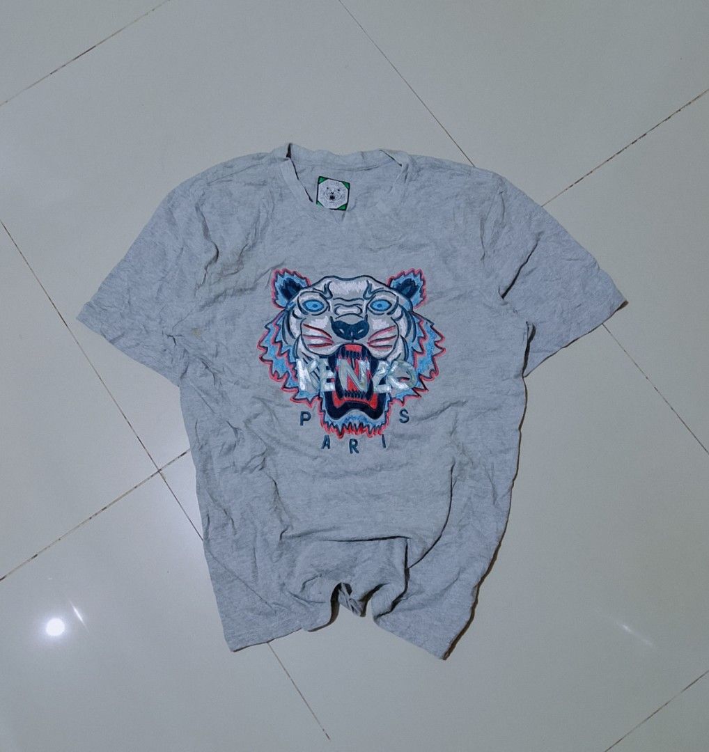 Kenzo tiger tee (Category: Tshirts & Polo Shirts ) located in Cagayan de Oro. Submitted by cjsthrifts (Listing ID 1461986399, Image 1). Description: Condition: Good Size: Medium Dimes: 20 × 27.5 Issue: Multiple yellow/rusty -ish stains Color rating: 9/10 Overall rating: 8.8/10 CLAIM: 200 shipped.