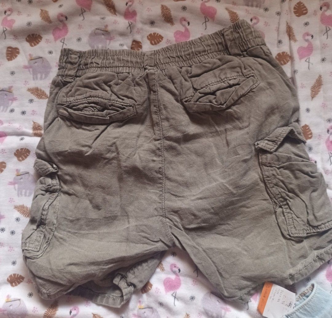 Kids Cargo Shorts (Category: Babies & Kids Fashion) located in Pasig City. Submitted by zeallion_149f0e (Listing ID 1461868652, Image 2). Description: - Olive green cargo shorts for kids - Comfortable elastic waistband with adjustable drawstring - Multiple functional pockets on front and sides - Ideal for everyday wear and outdoor activities - Made with durable material for lasting wear.