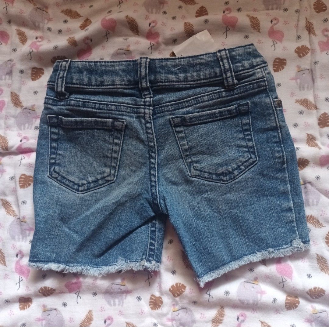 Kids Denim Shorts (Category: Babies & Kids Fashion) located in Pasig City. Submitted by zeallion_149f0e (Listing ID 1461868646, Image 2). Description: - Adorable blue denim shorts for kids - Trendy frayed hem detail - Classic 5-pocket design - Secure button and zip closure - Ideal for everyday casual wear - Effortlessly pairs with t-shirts and tops.