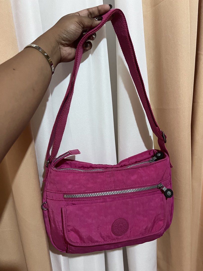 Kipling Crossbody Bag Pink Nylon (Category: Cross-body Bags) located in Kidapawan. Submitted by frizzyjayne (Listing ID 1461846745, Image 1). Description: - Pink Kipling crossbody bag - Durable nylon material - Multiple pockets for excellent organization - Smooth working zippers - Adjustable strap for comfortable wear - Perfect for everyday use.
