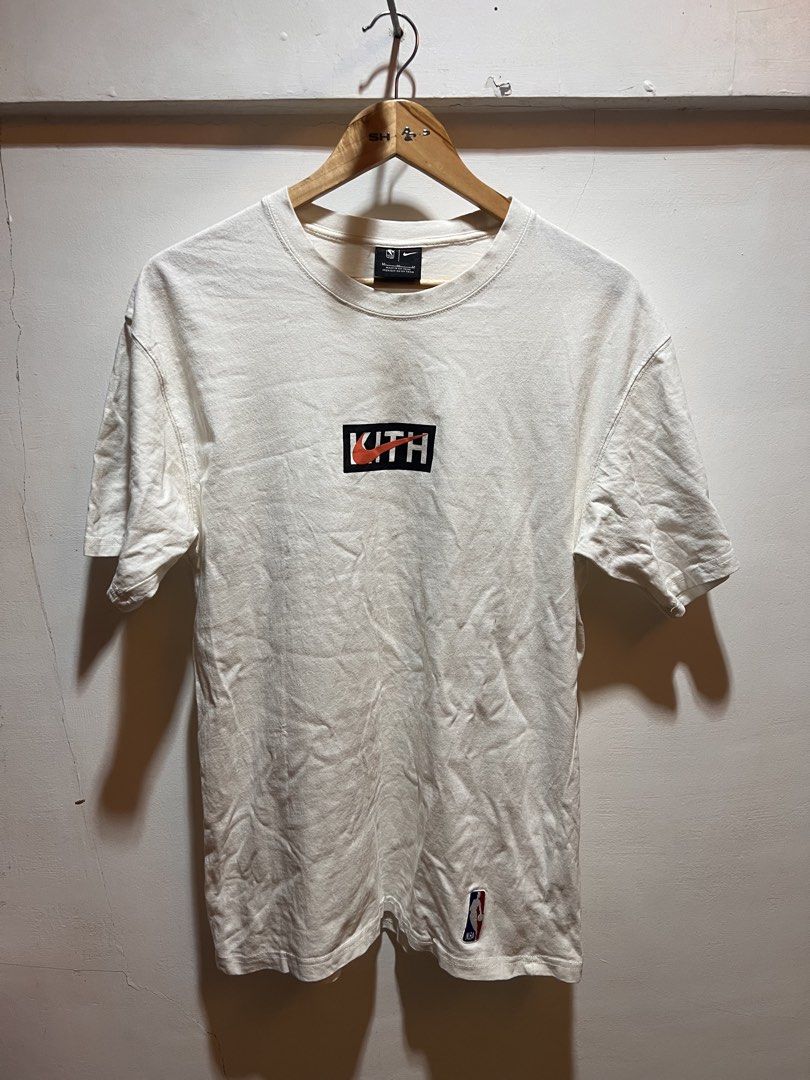 Kith x Nike White T-shirt (Category: Tshirts & Polo Shirts ) located in San Juan, La Union. Submitted by jeggystyle (Listing ID 1461962803, Image 1). Description: - Authentic White Kith x Nike T-shirt - Features iconic Kith logo and Nike swoosh - NBA logo detail on the bottom hem - Perfect for everyday casual wear - Please check photos for detailed condition.