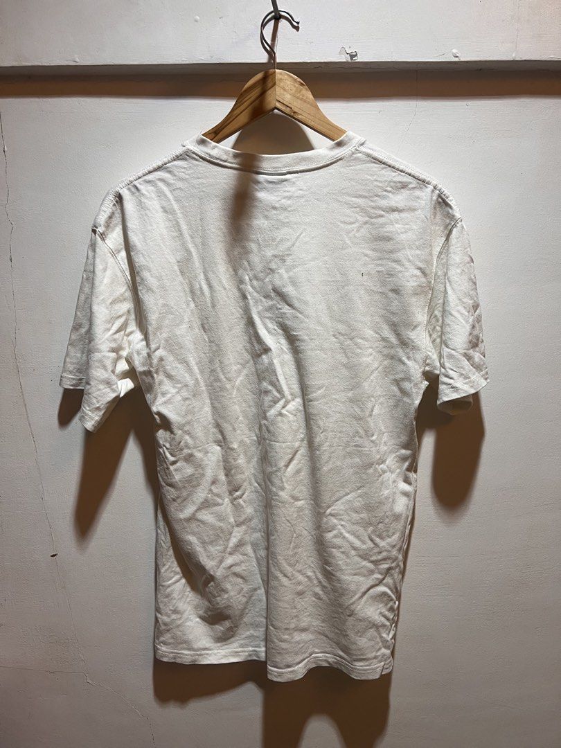 Kith x Nike White T-shirt (Category: Tshirts & Polo Shirts ) located in San Juan, La Union. Submitted by jeggystyle (Listing ID 1461962803, Image 3). Description: - Authentic White Kith x Nike T-shirt - Features iconic Kith logo and Nike swoosh - NBA logo detail on the bottom hem - Perfect for everyday casual wear - Please check photos for detailed condition.