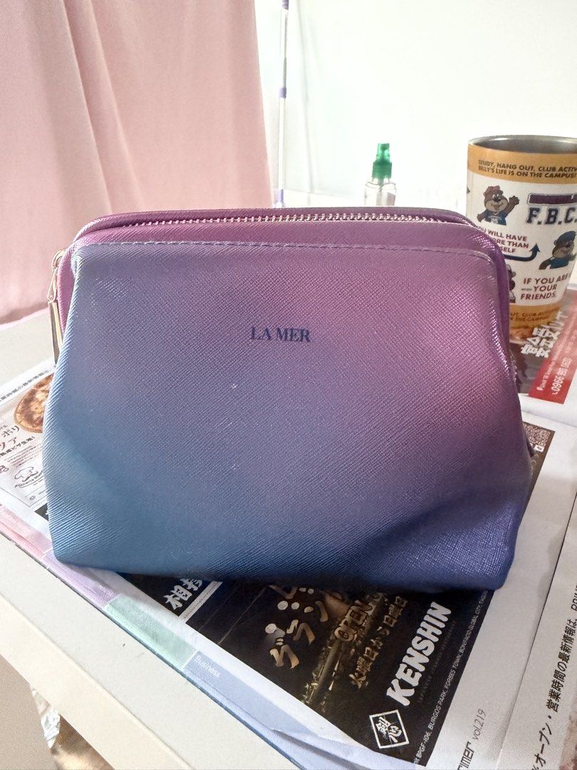 LA MER Ombre Cosmetic Bag (Category: Makeup) located in Manila. Submitted by treeal (Listing ID 1461849551, Image 1). Description: - La Mer cosmetic bag - Stunning pink to blue ombre design - Secure zipper closure - Lined interior for protection - Ideal for travel or everyday organization.