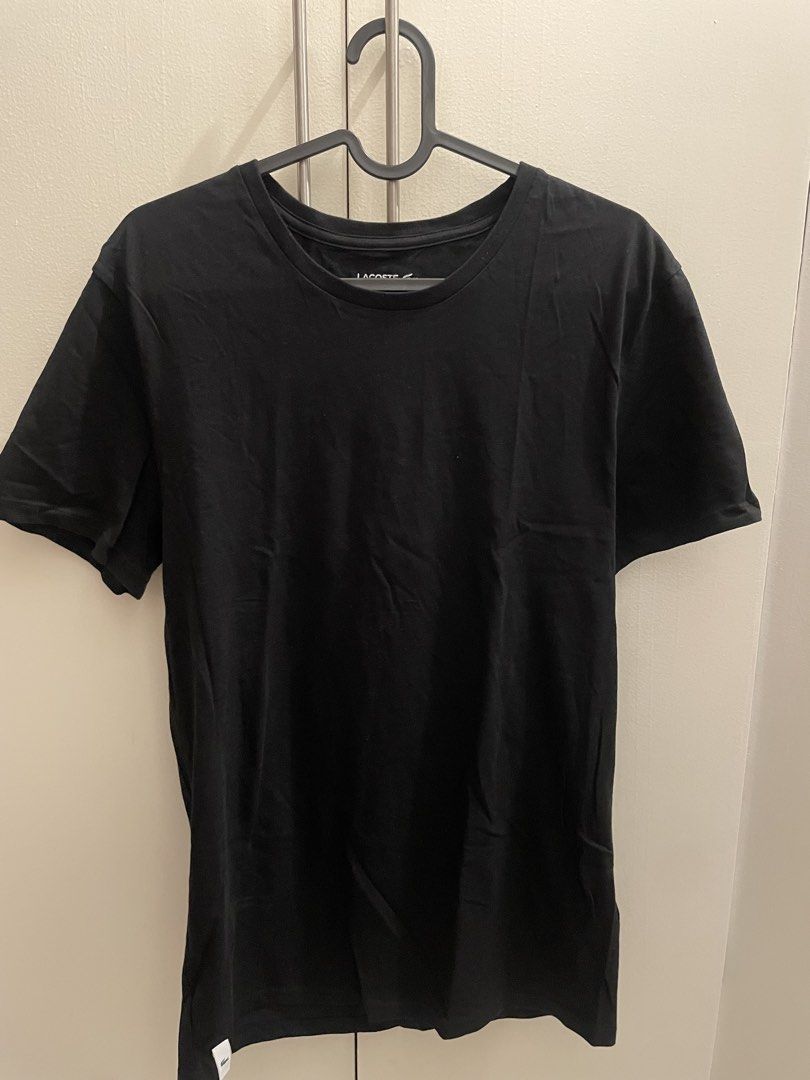 Lacoste Black T-shirt (Category: Tshirts & Polo Shirts ) located in Manila. Submitted by jmmasangca50900 (Listing ID 1461972182, Image 1). Description: - Classic black Lacoste t-shirt - Crew neck, short sleeves - Versatile and easy to pair with any outfit - A wardrobe essential.