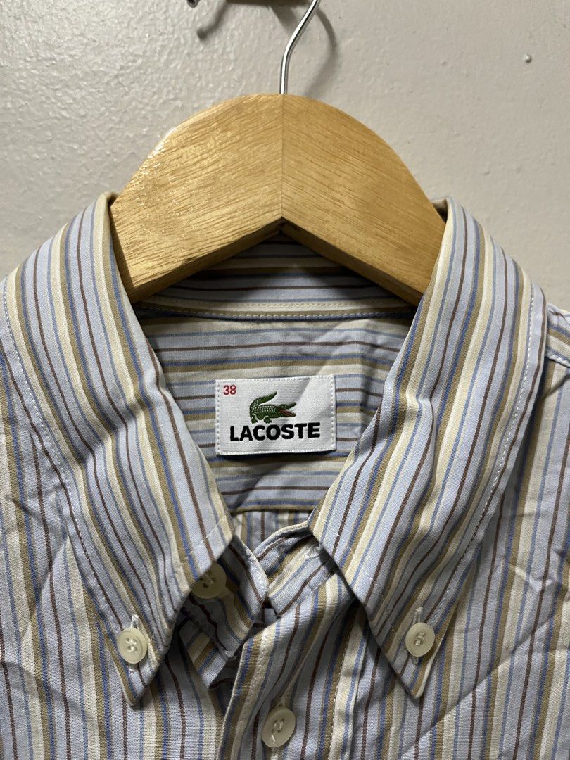Lacoste Blue Stripes Polo (Category: Formal Shirts) located in Mandaluyong City. Submitted by pochesguerra (Listing ID 1461895521, Image 3). Description: Lacoste Blue Stripes Polo SIZE: 38 DIMES: 21 x 29.5-31 ISSUE: Stain in the Collar PRICE: 700 PESOS + SHIPPING FEE.