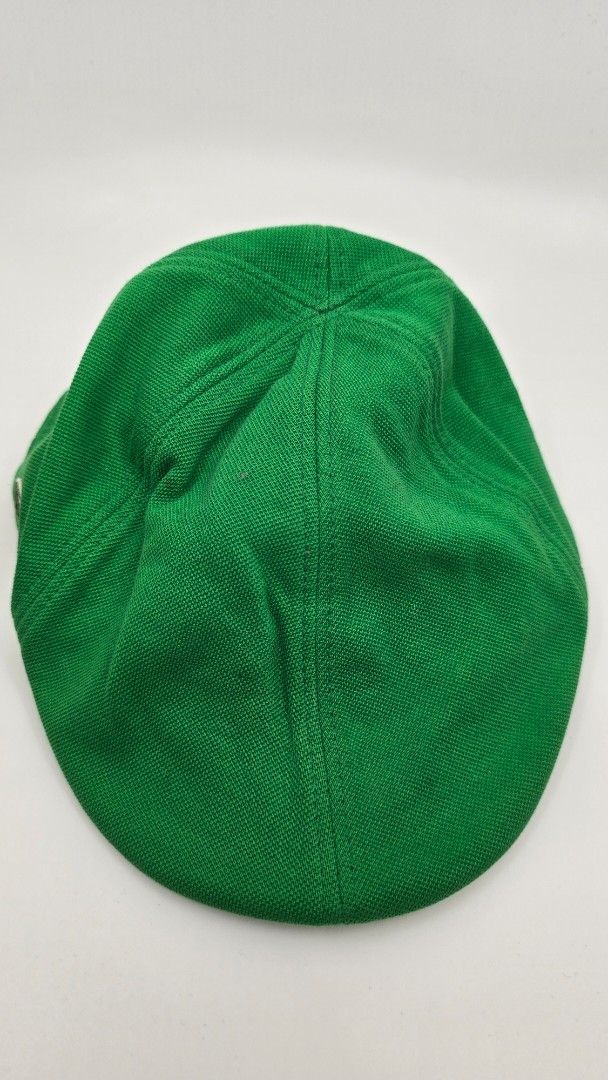 Lacoste Green Cap with Crocodile Logo (Category: Caps & Hats) located in Quezon City. Submitted by ShoesManila (Listing ID 1461983706, Image 2). Description: Lacost flat cap Fit the most Condition: Excellent Color rate: 10/10 Complete tags Ready to use - Authentic Green Lacoste Cap - Iconic crocodile logo on the side - Textured material (likely cotton blend) - Ideal for casual wear Ready to ship No COD Location: Diliman, QC .