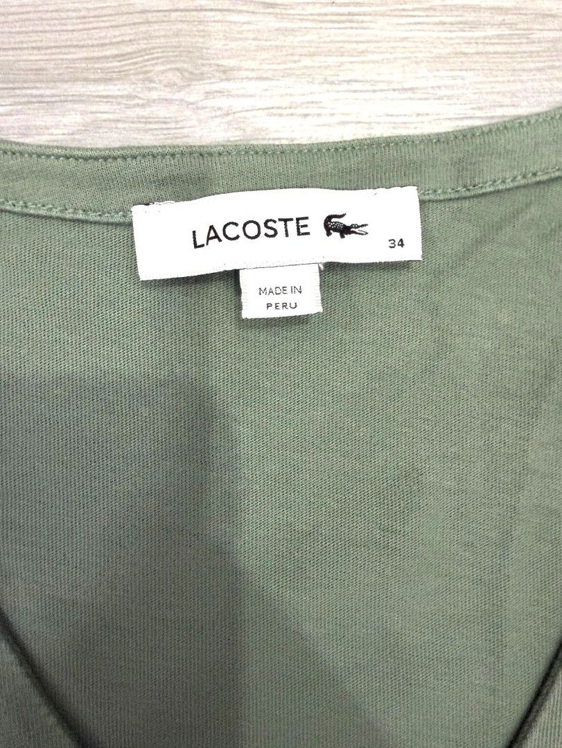 LACOSTE green shirt (Category: Shirts) located in Quezon City. Submitted by declutteritemsxx (Listing ID 1461881342, Image 2). Description: All items are from my personal wardrobe po. Some are brand new/unworn, while others have only been worn once or twice. Selling to declutter my closet.