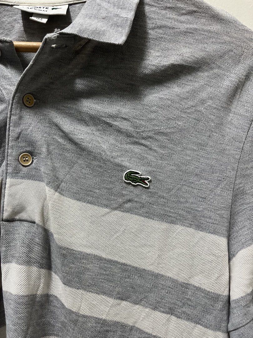 Lacoste Grey Stripes Polo Shirt (Category: Formal Shirts) located in Mandaluyong City. Submitted by pochesguerra (Listing ID 1461895710, Image 2). Description: Lacoste Grey Stripes Polo Shirt SIZE: M DIMES: 19.5 x 27 ISSUE: Faded, Color Rate 8 / 10 PRICE: 600 PESOS + SHIPPING FEE.
