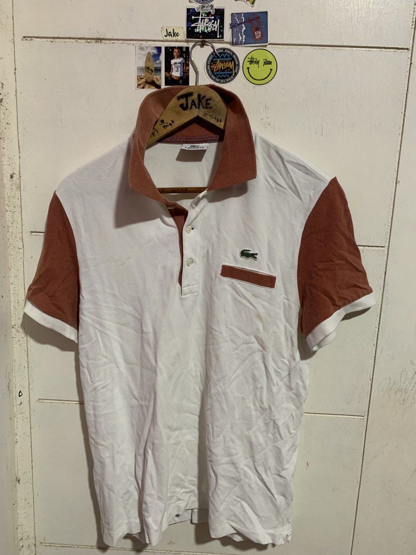 Lacoste Polo Shirt White & Rust Color Block (Category: Tshirts & Polo Shirts ) located in Bauang. Submitted by jkjk32 (Listing ID 1461957997, Image 1). Description: - Classic Lacoste polo shirt - White body with rust colored sleeves and collar - Iconic crocodile logo on chest pocket - Size 3 - Ideal for casual wear.