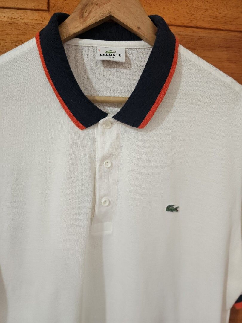 Lacoste White Polo Shirt (Category: Tshirts & Polo Shirts ) located in Dasmarinas. Submitted by ynnamargaux (Listing ID 1461805382, Image 2). Description: Brand: Lacoste Style: Regular Fit Contrast Collar/Tipped Polo Shirt 100% Cotton Color: White with Navy and Red Size : 8 SLIMFIT.