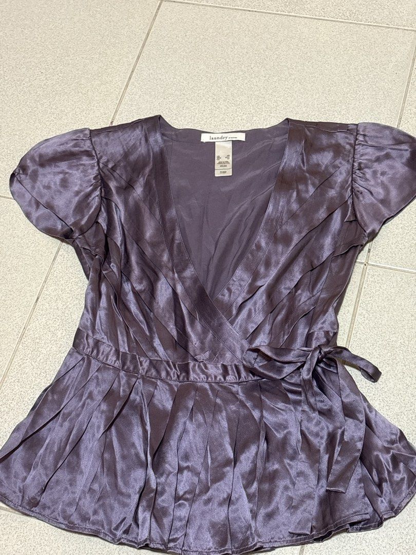 Laundry by Design Purple Silk Wrap Blouse XS (Category: Blouses) located in Quezon City. Submitted by melody0812 (Listing ID 1461890485, Image 1). Description: - Laundry by Design purple silk wrap blouse - Size XS - Short, puffed sleeves - Tie waist closure - Pleated details on bodice and skirt - Made of 100% silk.
