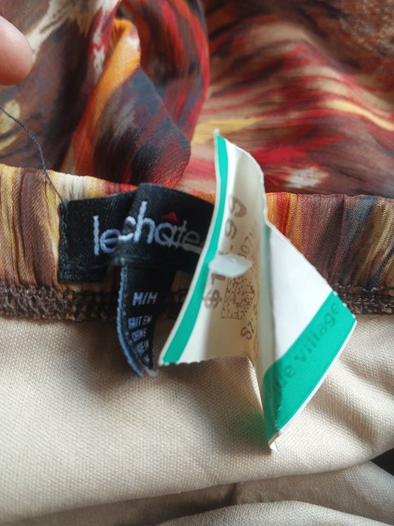 Y2K Le Chateau Strapless Hi-Low Dress (Category: Dresses) located in Manila. Submitted by icamalicdem29 (Listing ID 1461899090, Image 3). Description: - Strapless design - Ruched bust detail - Bold animal print (brown, red, tan) - High-low hemline (shorter in front, longer in back) - Lightweight fabric - Ideal for a night out.