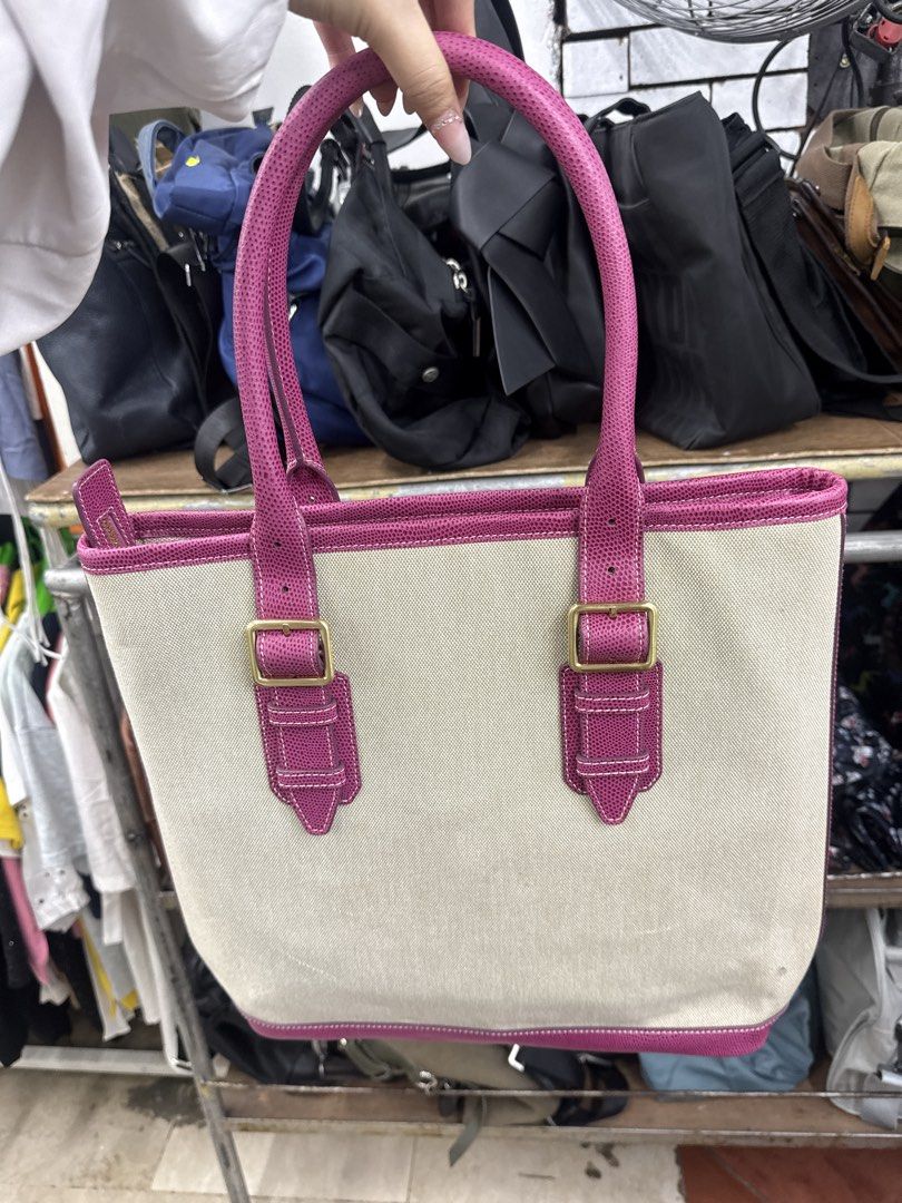 Lee Studio Canvas Tote Bag with Pink Trim (Category: Tote Bags) located in Manila. Submitted by fastlion.584bdf (Listing ID 1461813930, Image 3). Description: - Lee Studio canvas tote bag - Chic pink trim and handles - Elegant gold hardware details - Secure zipper closure - Spacious interior for all your essentials - Ideal for everyday errands or weekend getaways.
