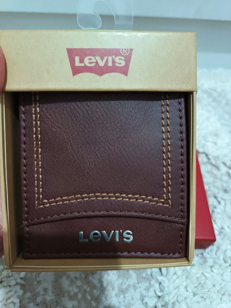 Levi's Brown Leather Bifold Wallet (Category: Wallets & Card Holders) located in Caloocan City. Submitted by adidaszler (Listing ID 1461799868, Image 1). Description: - Genuine Levi's brown leather bifold wallet - Stylish stitching detail on the front - Ample card slots for all your essentials - Includes original Levi's packaging - Ideal for everyday carry and use.