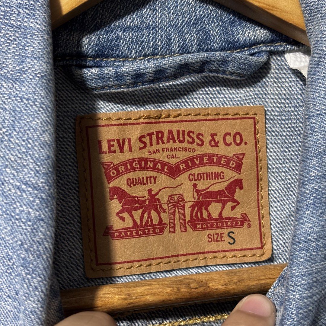 Levi's Denim Jacket - Size S - Very Good Condition (Category: Coats, Jackets and Outerwear) located in Caloocan City. Submitted by bonsatocha43876 (Listing ID 1461984128, Image 3). Description: - Classic Levi's denim jacket - Light blue wash - Button-up front with two chest pockets - Measurements: 18 inches width, 20 inches length - Original tags complete - Perfect wardrobe staple - Price: 750 pesos only.