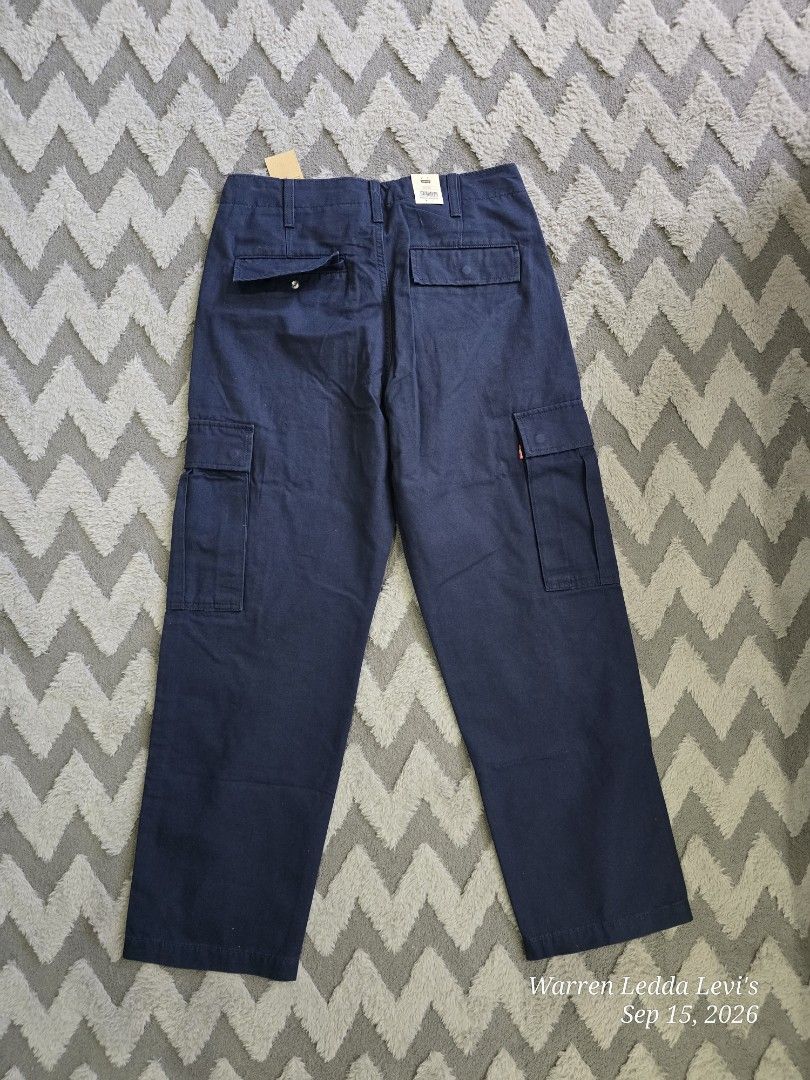 Levi's Navy Blue Cargo Pants (Category: Jeans) located in Manila. Submitted by wd_closet (Listing ID 1462025073, Image 2). Description: - Brand new Levi's cargo pants - Classic navy blue color - Straight fit for everyday comfort - Multiple practical pockets - Tags still attached - A versatile addition to your wardrobe.
