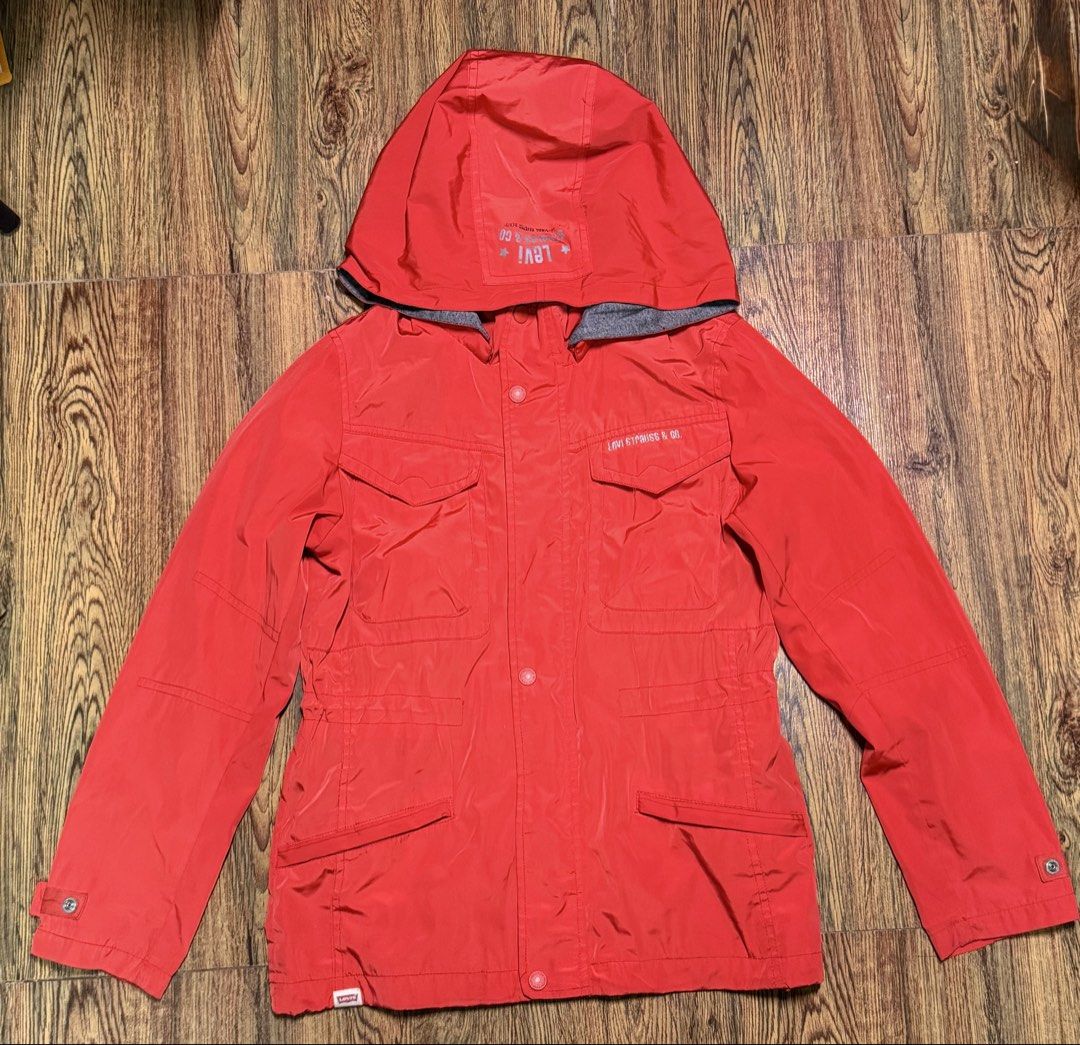Levi's Red Hooded Jacket (Category: Coats, Jackets and Outerwear) located in Manila. Submitted by bunsmayo31 (Listing ID 1461991522, Image 1). Description: - Classic Red Levi's Jacket - Attached Hood for extra warmth - Multiple functional pockets on the front - Lined with soft grey fabric - Secure button closure - Adjustable toggles at the hem for a customized fit - Ideal for cooler weather and layering.
