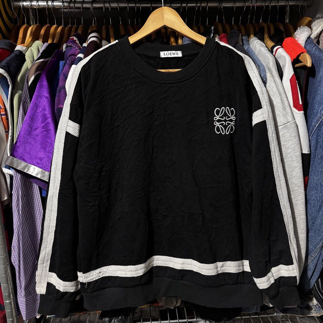 LOEWE Black Sweatshirt with White Stripes (Category: Longsleeves) located in Caloocan City. Submitted by bonsatocha43876 (Listing ID 1461984710, Image 3). Description: - Brand: LOEWE - Color: Black - Design: White stripes on sleeves and hem - Condition: Very good, complete with tags - Measurements: Width 23 inches, Length 25 inches - Price: PHP 800 only.