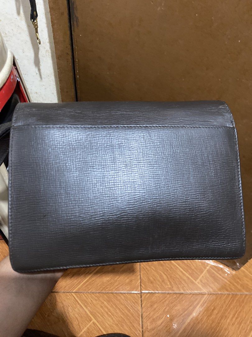 Loewe Leather Clutch Bag (Category: Luxury Bags & Wallets) located in Manila. Submitted by junejanuary (Listing ID 1461853347, Image 2). Description: - Authentic Loewe clutch in a rich dark brown. - Crafted from textured leather for a luxurious feel. - Elegant silver-tone hardware, subtly branded with the Loewe logo. - Classic, minimalist design suitable for any evening occasion. - Elevate your look with this chic statement accessory..