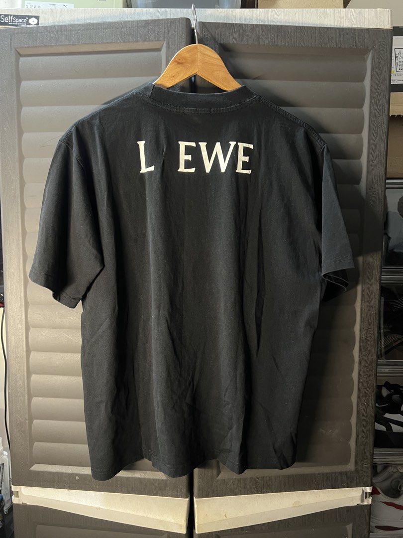 Loewe x Studio Ghibli Kaonashi (Category: Tshirts & Polo Shirts ) located in Angono. Submitted by odd.fitt (Listing ID 1461979879, Image 2). Description: Large on tag 23W 26L Repaired Natanggal Soot Sprite sa likod that serves as "O" .
