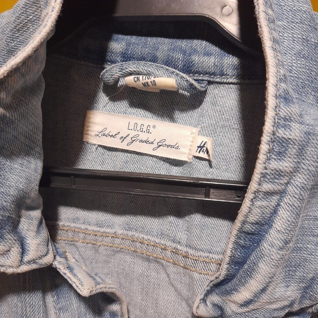 L.O.G.G. Denim Jacket (Category: Coats, Jackets and Outerwear) located in Pasig City. Submitted by chesca_closet (Listing ID 1461949615, Image 2). Description: - Light wash denim jacket - Brand: L.O.G.G. (Label of Graded Goods) - Classic trucker style - Button closure - Chest pockets - Estimated size: 10 - Ideal for layering - Versatile wardrobe staple.