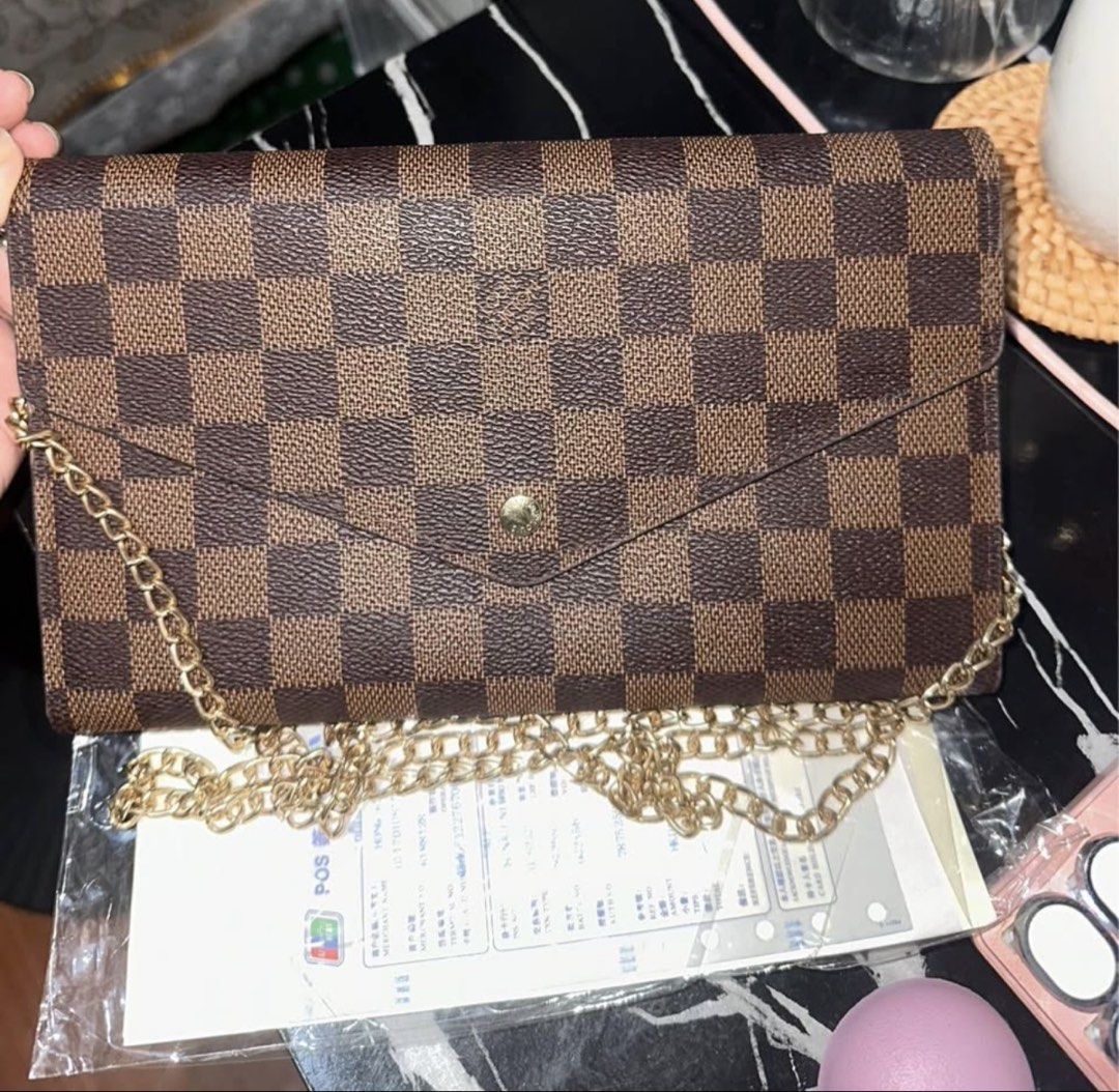 Louis Vuitton Damier Ebene Canvas Wallet on Chain (Category: Luxury Bags & Wallets) located in Consolacion. Submitted by sanboom (Listing ID 1461830224, Image 1). Description: .