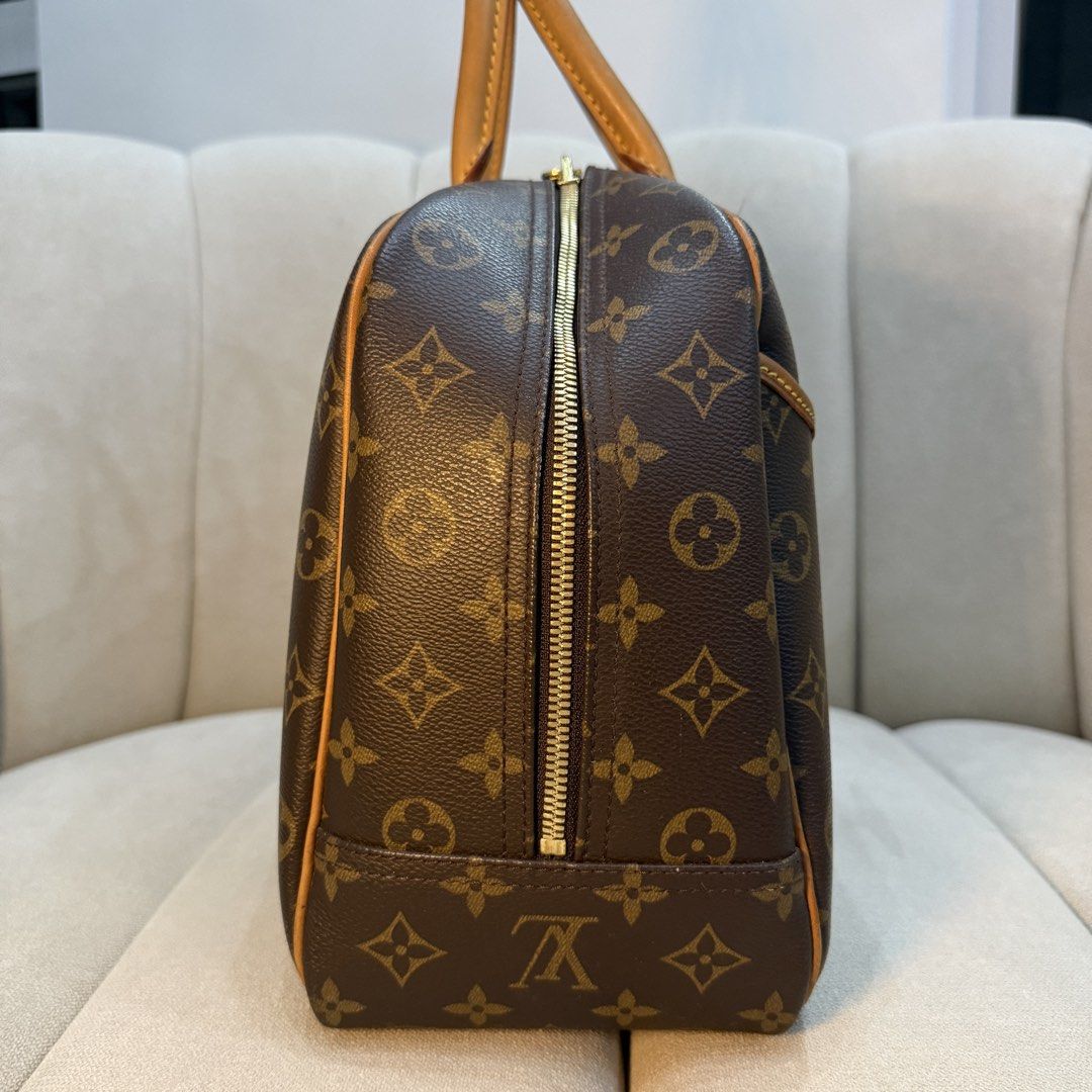 Louis Vuitton Monogram Deauville (Category: Luxury Bags & Wallets) located in Legazpi City. Submitted by kfmesposito (Listing ID 1461988653, Image 3). Description: - Monogram canvas with tan leather trim and handles - Gold-tone zipper closure - Timeless and versatile for everyday or travel - Spacious interior.