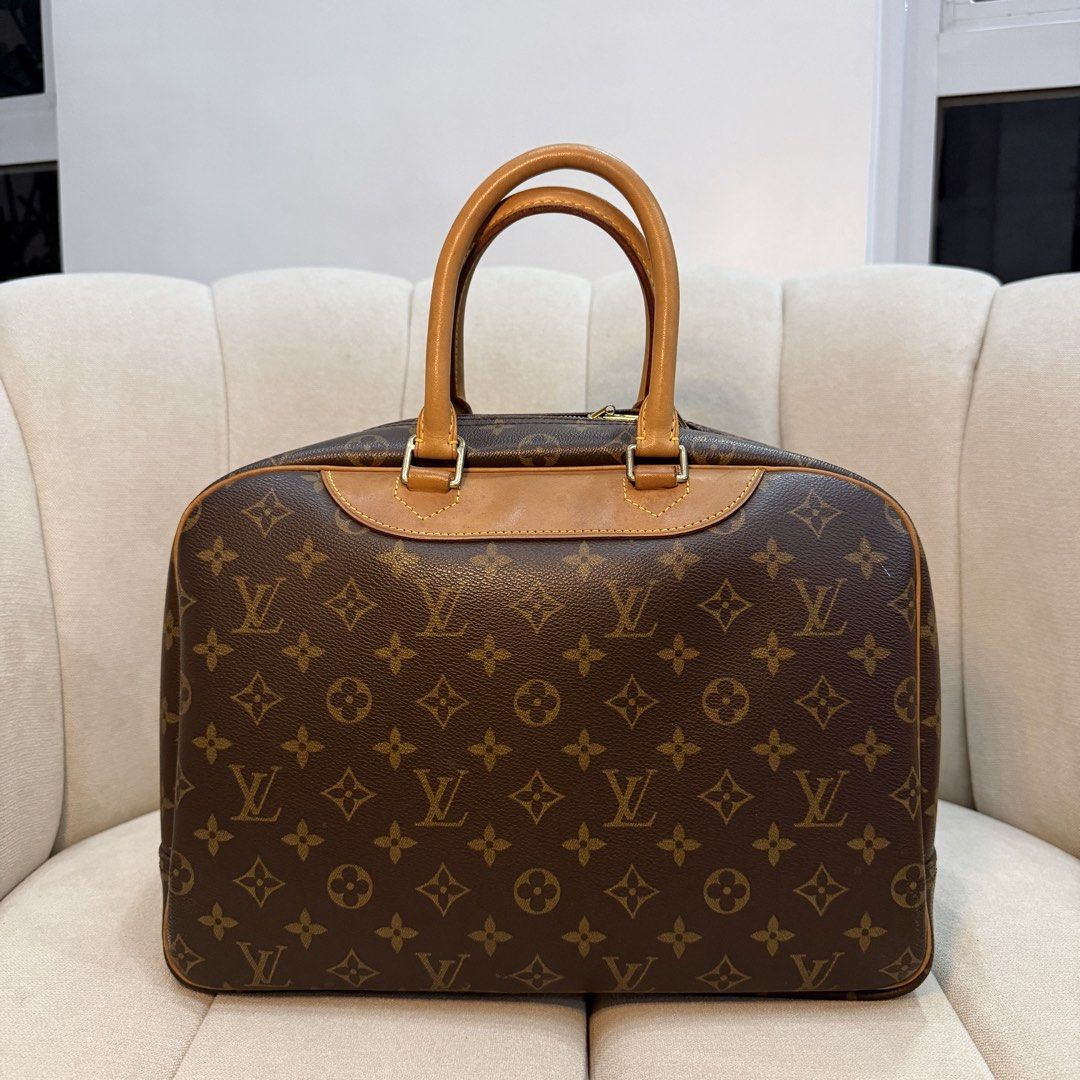 Louis Vuitton Monogram Deauville (Category: Luxury Bags & Wallets) located in Legazpi City. Submitted by kfmesposito (Listing ID 1461988653, Image 2). Description: - Monogram canvas with tan leather trim and handles - Gold-tone zipper closure - Timeless and versatile for everyday or travel - Spacious interior.