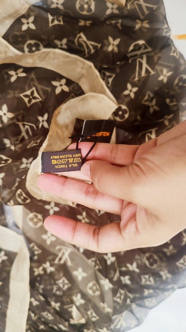 Louis Vuitton Monogram Silk Scarf (Category: Scarves) located in Manila. Submitted by anez06 (Listing ID 1461838971, Image 3). Description: - Classic brown and beige monogram pattern - Made from luxurious silk - Light and airy feel - Features 'Louis Vuitton Inventeur Paris' detail - Care instructions: Dry clean only - A perfect addition to your designer collection.