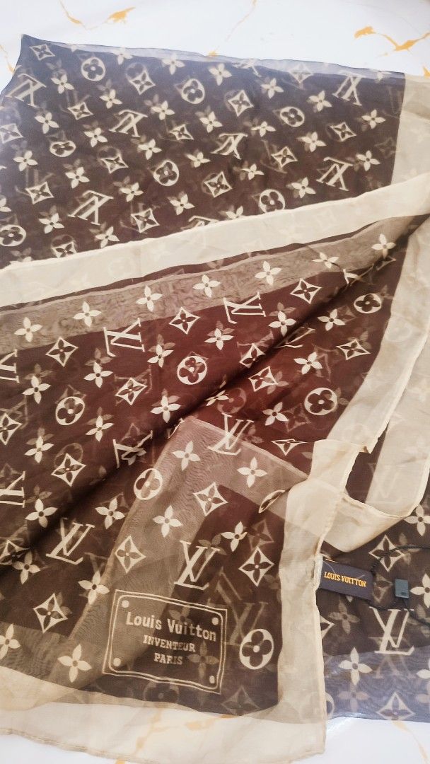 Louis Vuitton Monogram Silk Scarf (Category: Scarves) located in Manila. Submitted by anez06 (Listing ID 1461838971, Image 2). Description: - Classic brown and beige monogram pattern - Made from luxurious silk - Light and airy feel - Features 'Louis Vuitton Inventeur Paris' detail - Care instructions: Dry clean only - A perfect addition to your designer collection.