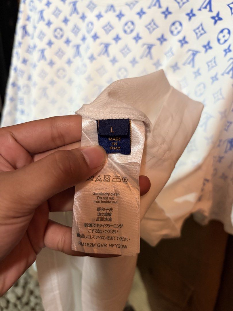 Louis Vuitton Monogram T-Shirt White Blue (Category: Tshirts & Polo Shirts ) located in Digos. Submitted by razzz08 (Listing ID 1461982262, Image 3). Description: - Authentic Louis Vuitton T-Shirt - Color: White with Blue Monogram Print (fading towards bottom) - Size: L - Made in Italy - Care Instructions: Gentle dry clean only, do not rub, iron inside out. - 23.28.
