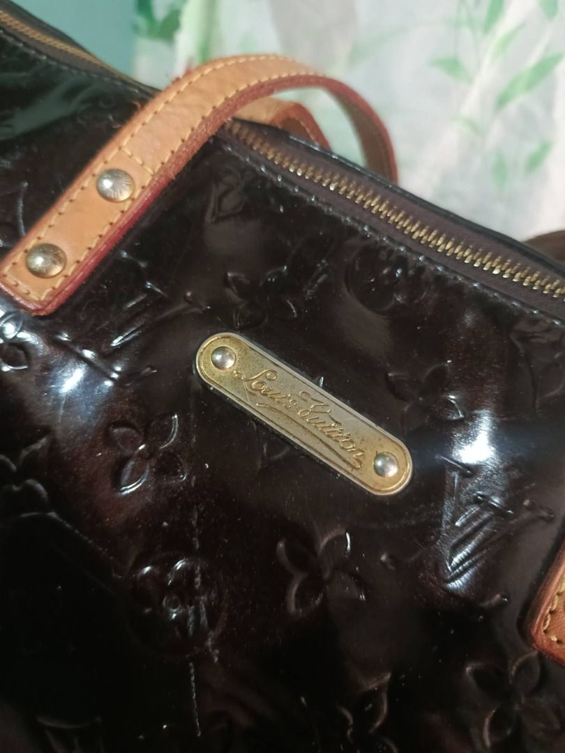 Louis Vuitton Monogram Vernis Tote Bag (Category: Luxury Bags & Wallets) located in Caloocan City. Submitted by janeeh_007 (Listing ID 1461870892, Image 3). Description: - Authentic Louis Vuitton Monogram Vernis tote bag - Very good condition - Color: Dark brown or Amarante - Material: Monogram Vernis patent leather - Closure: Zipper - Interior: Small leather tag with date code - Exterior: Metal plate with Louis Vuitton logo - Style: Tote / shoul