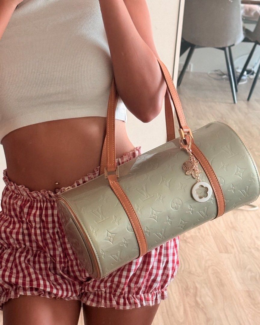 Louis Vuitton Monogram Vernis Papillon Bag (Category: Luxury Bags & Wallets) located in Tacloban City. Submitted by nikowlreads (Listing ID 1461963097, Image 1). Description: - Authentic Louis Vuitton Papillon bag - Monogram Vernis in a unique pale green color - Smaller size, ideal for essentials - Features leather trim and handles - Secure zipper closure.
