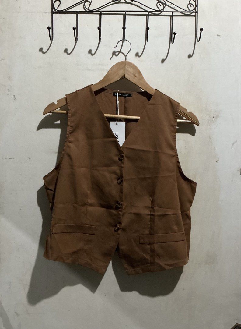 LOVITO BROWN VEST TOP (Category: Others Tops) located in Dagupan City. Submitted by trendies_collection (Listing ID 1462015789, Image 1). Description: Brand new with pouch and hang tag Large on tag, fits medium to large No issue.