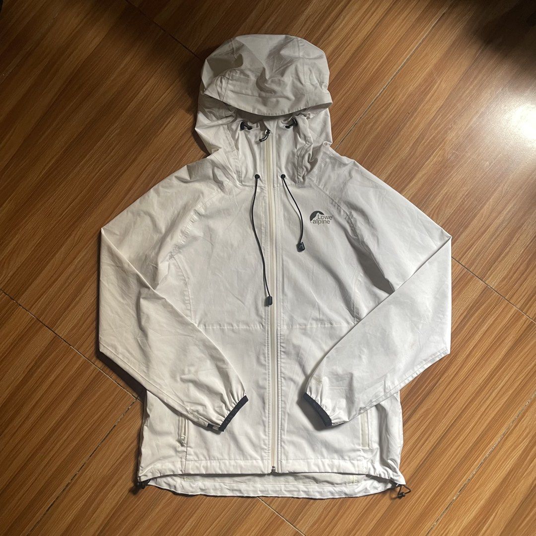Lowe Alpine Hooded Rain Jacket - Unisex (Category: Coats, Jackets and Outerwear) located in General Mariano Alvarez. Submitted by 4117_thriftnthrive (Listing ID 1462000272, Image 1). Description: Fair condition Stain, nag babakbak yung loob Size on tag: L Measurements Width: 20” Length: 25”.
