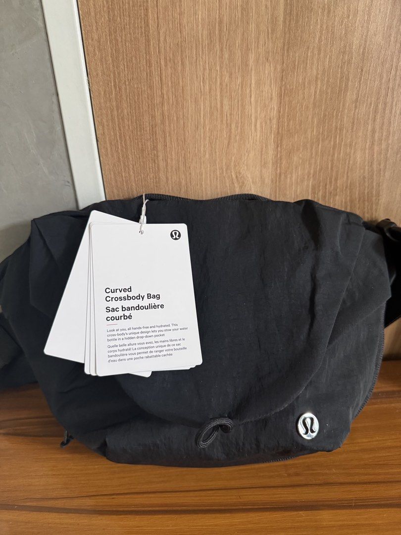 Lululemon Curved Crossbody Bag Black (Category: Cross-body Bags) located in Manila. Submitted by xenasales (Listing ID 1461909322, Image 1). Description: - Brand new Lululemon Curved Crossbody Bag - Color: Black - Hands-free design - Features a hidden drop-down pocket for water bottle - Ideal for keeping essentials secure and accessible - Perfect for everyday use or travel - Accepts lay away payment terms up to 3 mons(15 and 30).