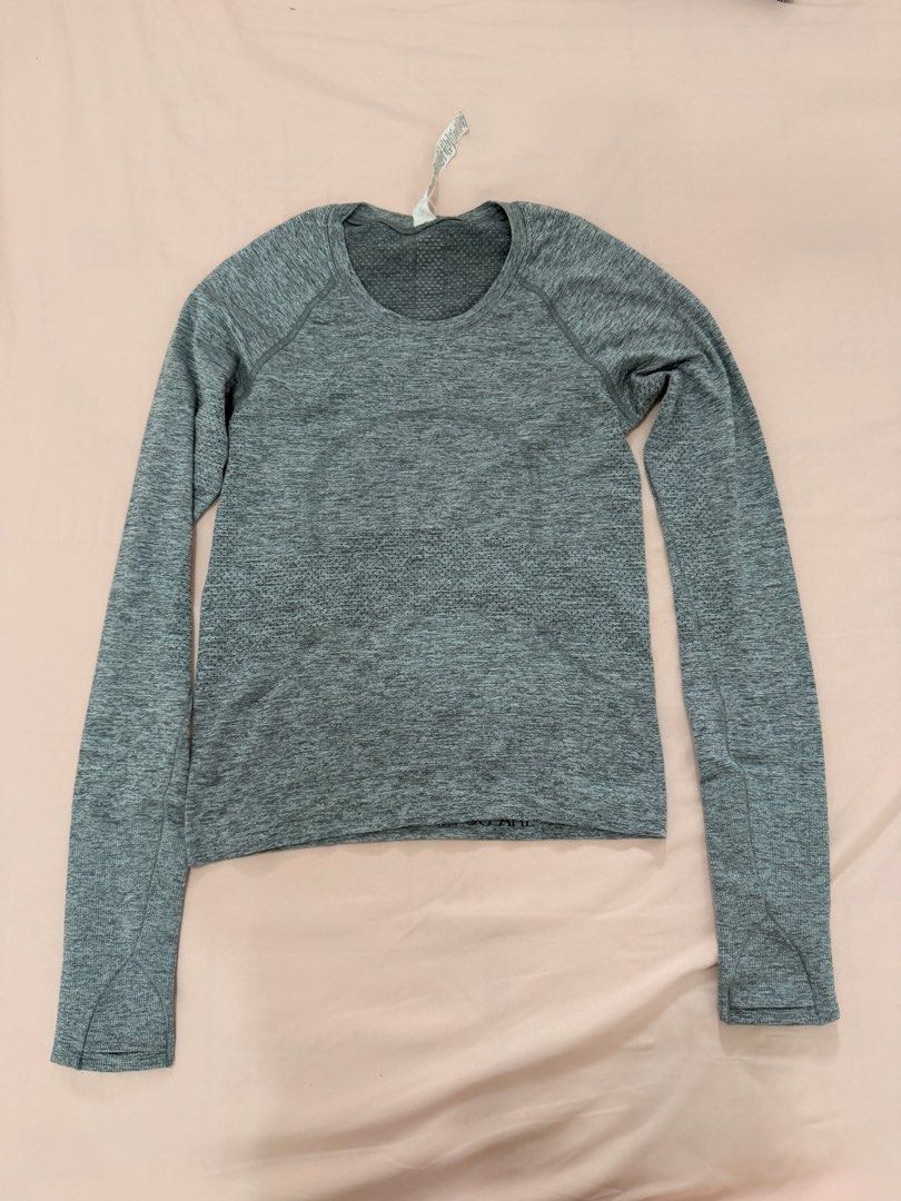 Lululemon Grey Heathered Seamless Long Sleeve Top (Category: Activewear) located in Tuguegarao City. Submitted by joysmithznjo (Listing ID 1461887835, Image 1). Description: - Lululemon grey heathered long sleeve top - Seamless knit fabric for comfort - Raglan sleeves for a sporty look - Cropped fit, stylish and modern - Versatile: great for workouts or casual wear - Brand new with tag still attached.